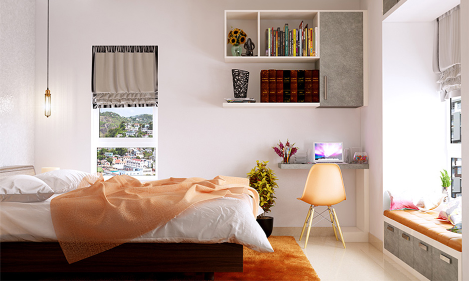Simple 10 by 10 bedroom design with wall-mounted shelves that organise space while keeping the floor area clear.