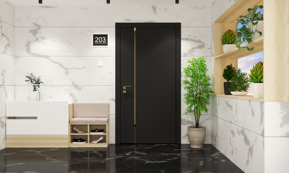 Elegant black and white ceramic tiles for a modern front wall design.
