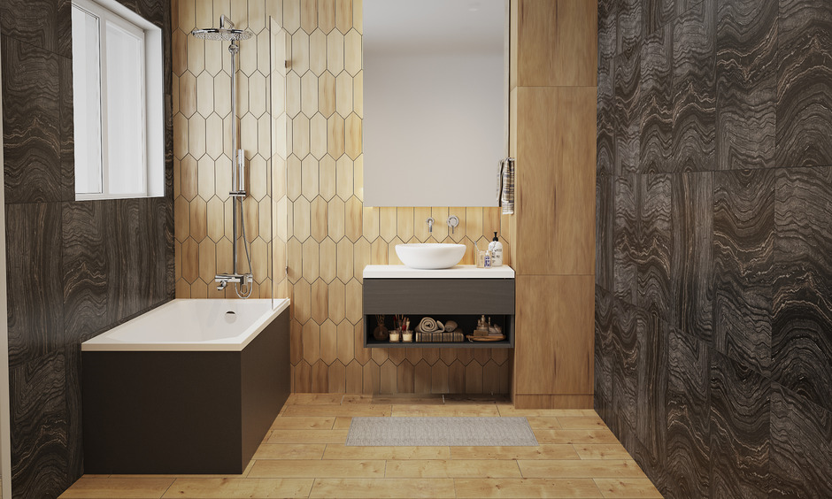 A modern bathroom design incorporates black tiles and wooden accents, creating a warm and balanced look.