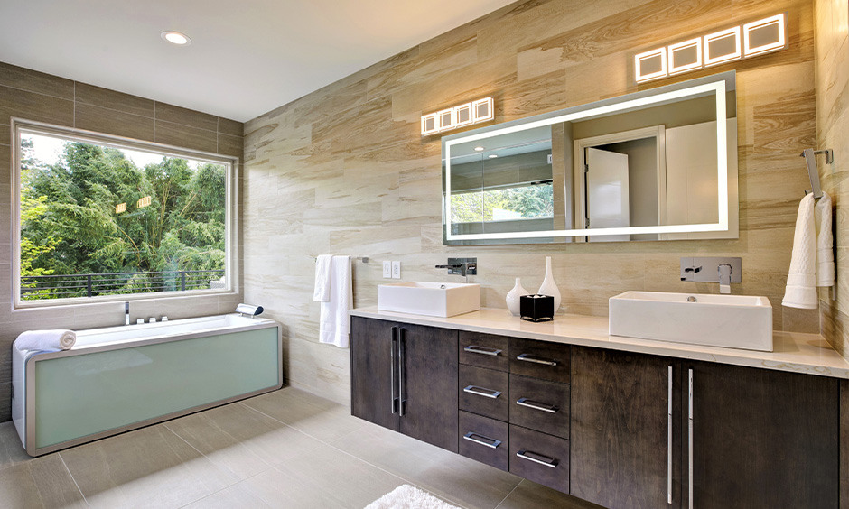 Bathroom decorating trends highlight innovative layered lighting for enhanced style and function.