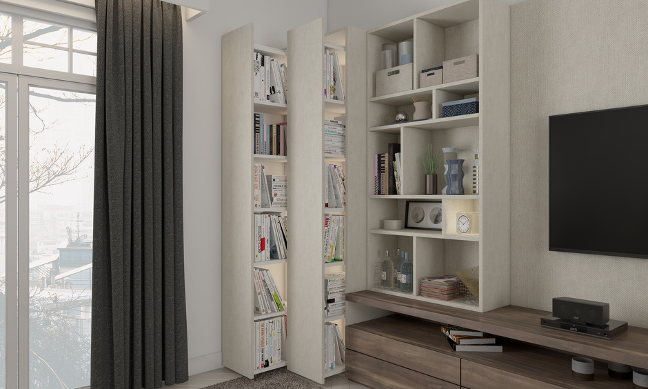 Hidden side almirah with retractable bookshelves optimises space in a modern living room