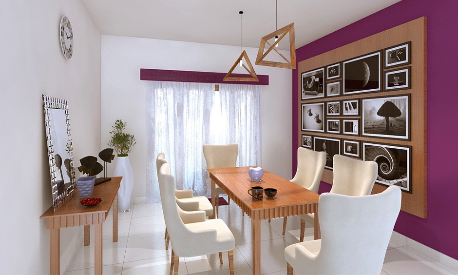 Modern contemporary dining room with wooden table, white chairs, and elegant pendant lights