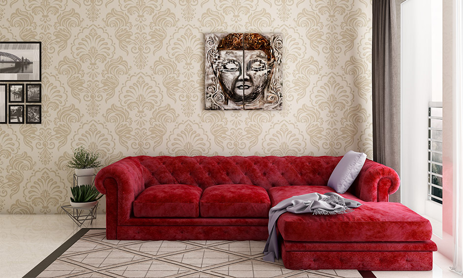 Bold red velvet three-seater sofa with ample dimensions, perfect for any living room space.