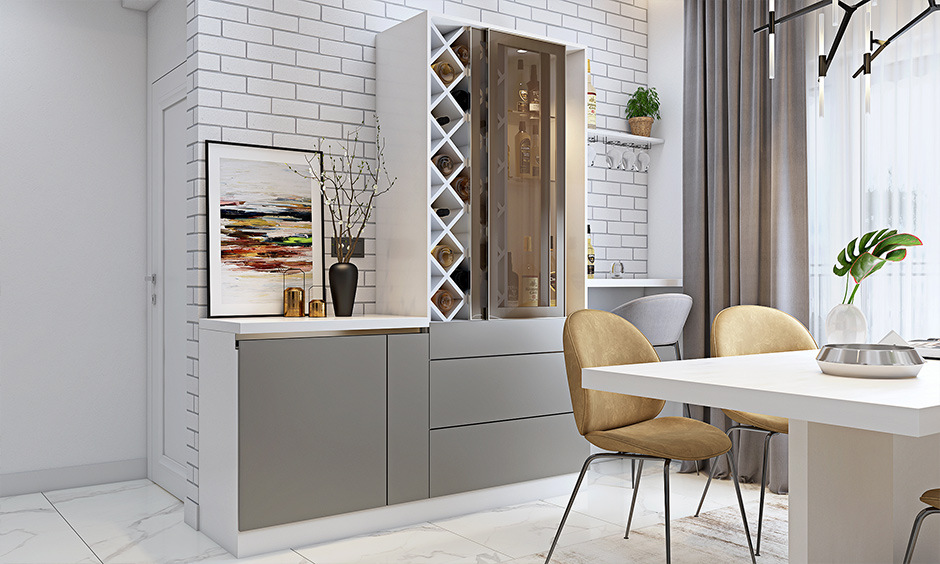 A small living room bar idea with matte grey and white unit, wine rack, and hidden lighting.