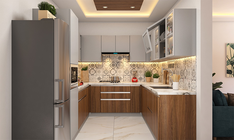A small U-shaped modular kitchen with wooden cabinets, lift-up unit, and under-cabinet lighting.