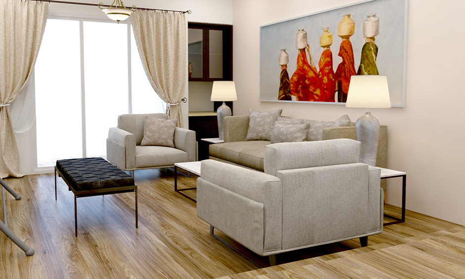 Elegant light grey three-seater sofa set with armchairs, adding sophistication to the family room.