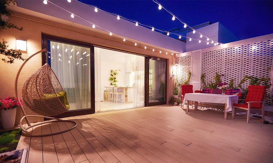 Wooden sliding door track connecting the living room to the patio for an open and inviting space