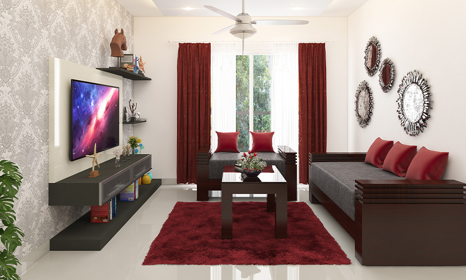 Wooden three-seater sofa cum bed with a matching table, offering comfort and rustic charm.