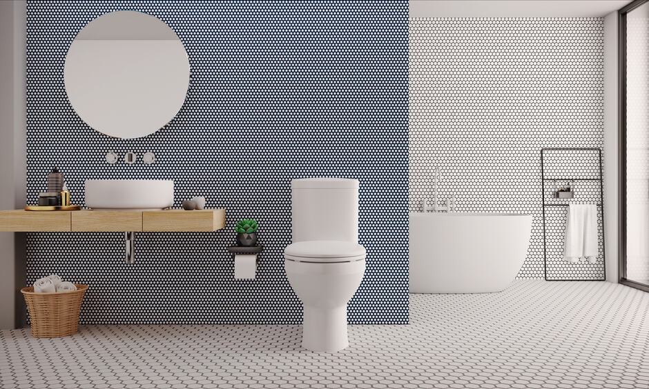 Modern bathroom with bold hexagonal-patterned 3D wall and floor tiles.