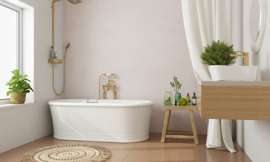 Spa-like bathroom in the Pantone shade Mocha Mousse with warm walls, plants, and ambient lighting.