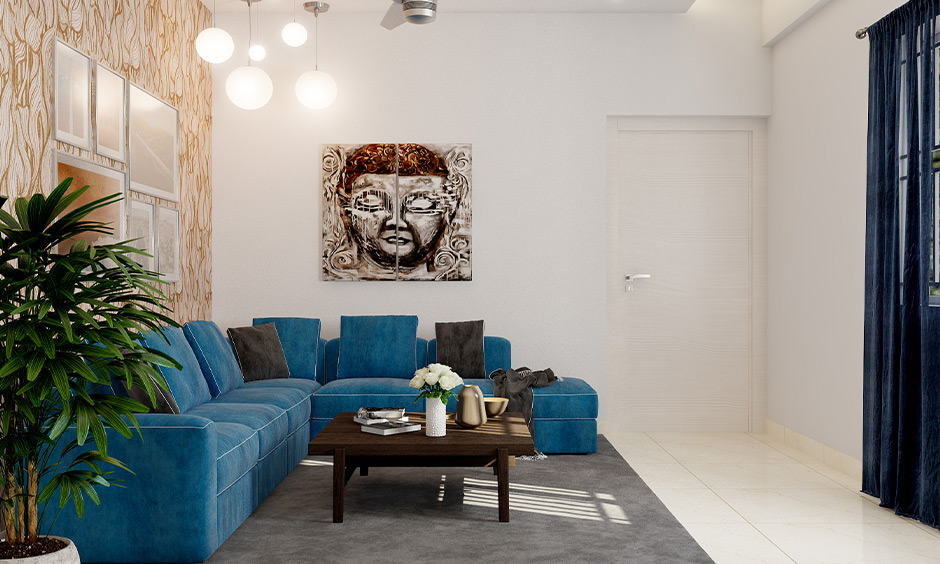 Beige and peacock blue living room with plush sofa and pendant lights