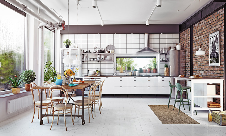 A kitchen loft design with exposed brick walls, white backsplash, and wooden furniture for a rustic charm
