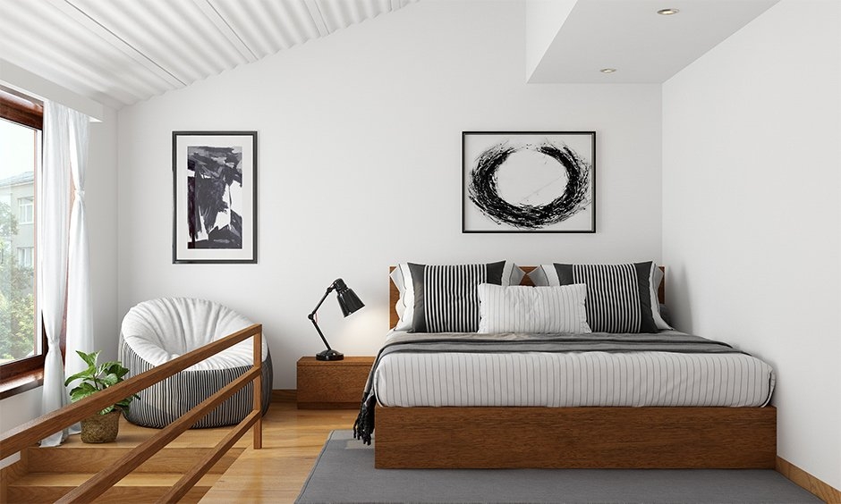 A small loft bedroom design with light interiors, minimal furniture, and cozy decor for a calming retreat.
