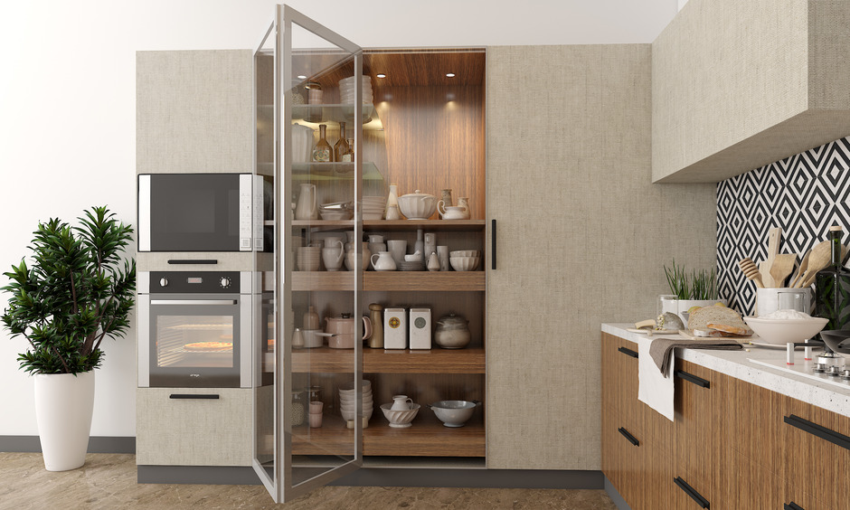 A glass-front crockery unit adding elegance to the kitchen.