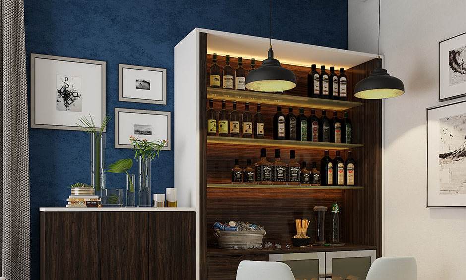 Dining room with peacock blue and dark brown colour combination and bar setup