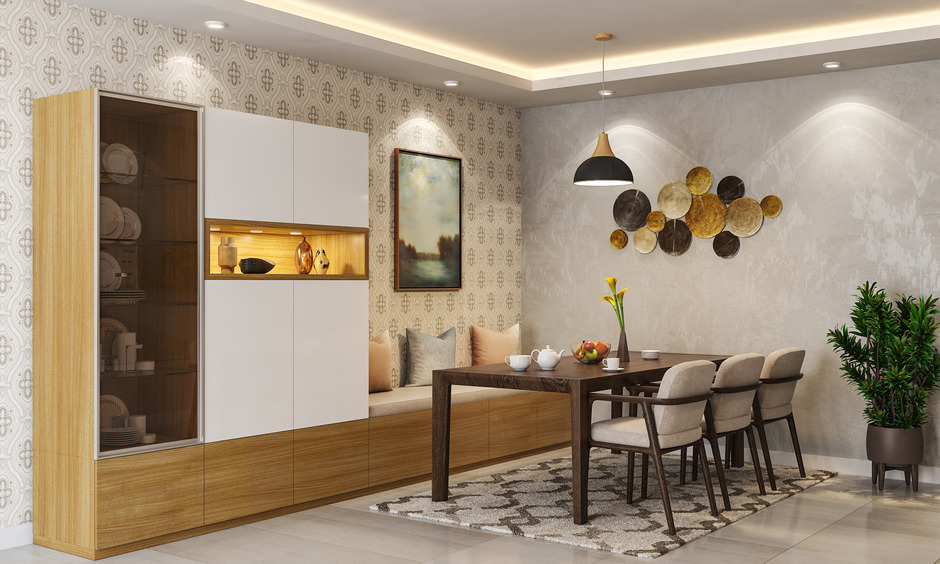 A dining room crockery unit with a built-in bench for extra seating.
