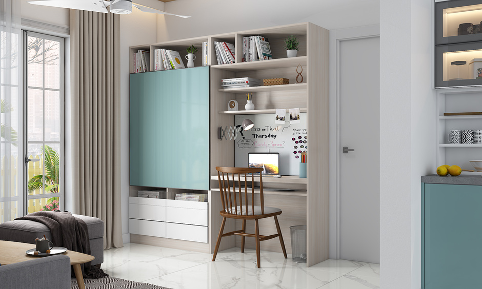 Home office with a dual-purpose furniture unit featuring a sliding door that reveals a desk on one side and an entertainment zone.