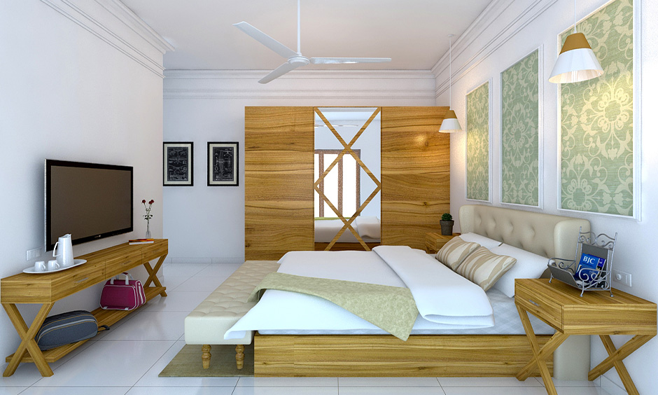 A mirror on the sliding wardrobe includes geometric carvings and frosted designs, adding unique visual interest.