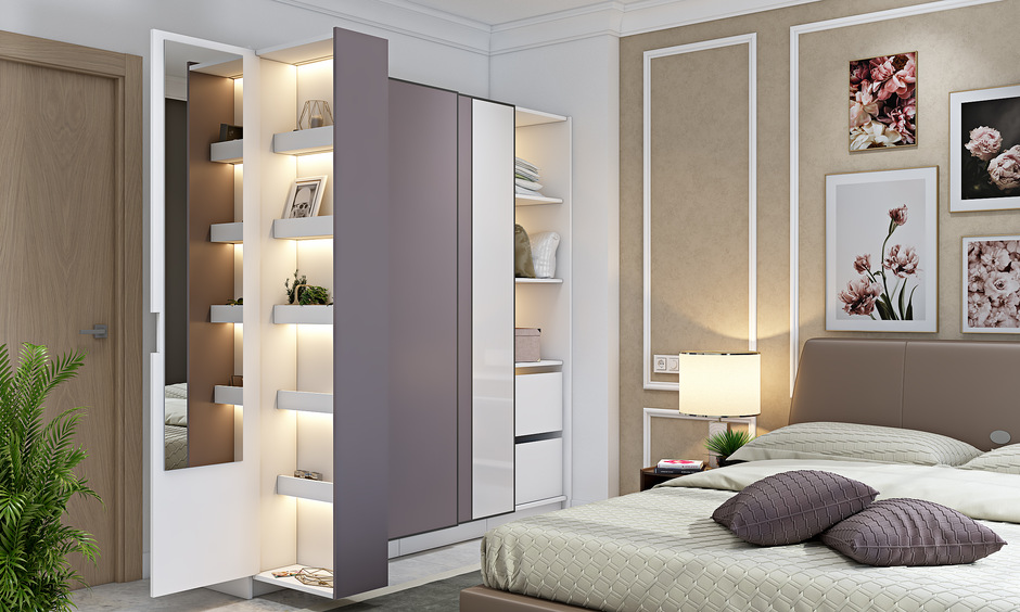 Wardrobe storage ideas for small spaces with a pull-out dressing unit and built-in lighting.