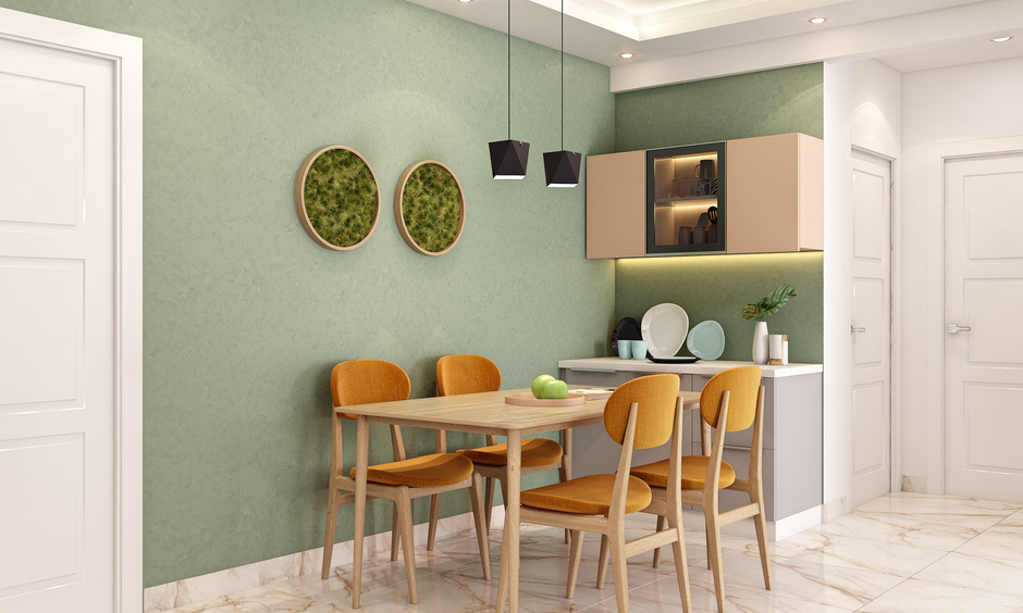 A compact crockery unit blending with a mustard-green dining space.