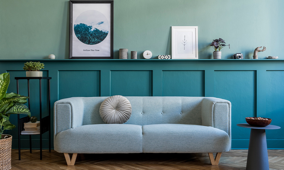 A designer-approved teal living room with earthy accents