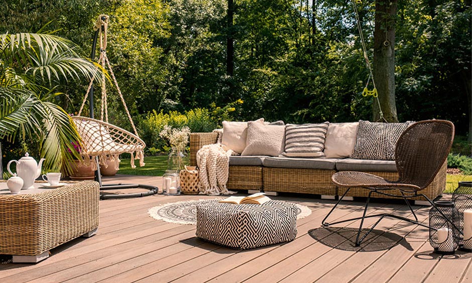 Wicker sofa set with a nearby hammock, creating a chill outdoor zone for relaxation and socializing.