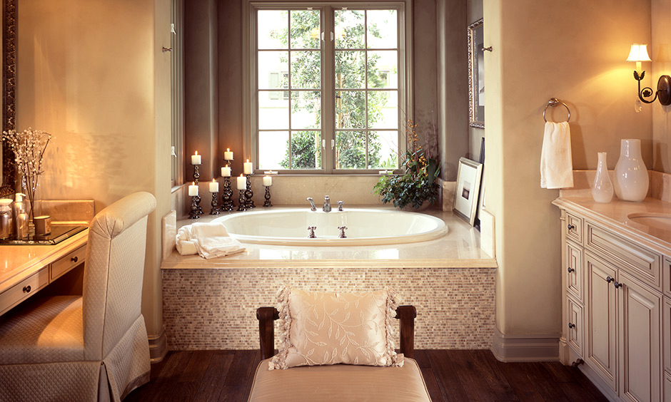 April home decorating idea with eucalyptus planters, rolled towels, and stylish bathroom accessories.