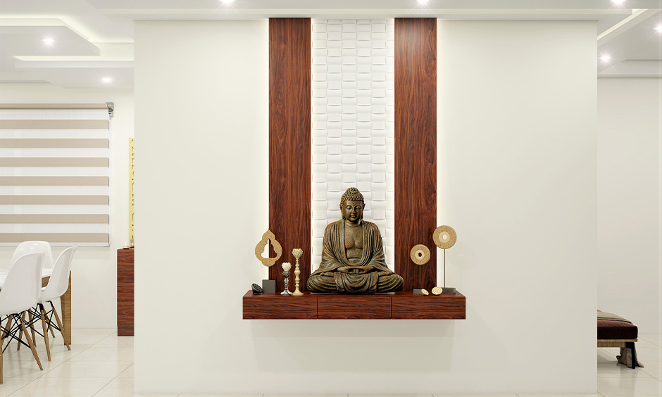 Modern floating shelves as pooja unit idea in living room, enhancing space and style.