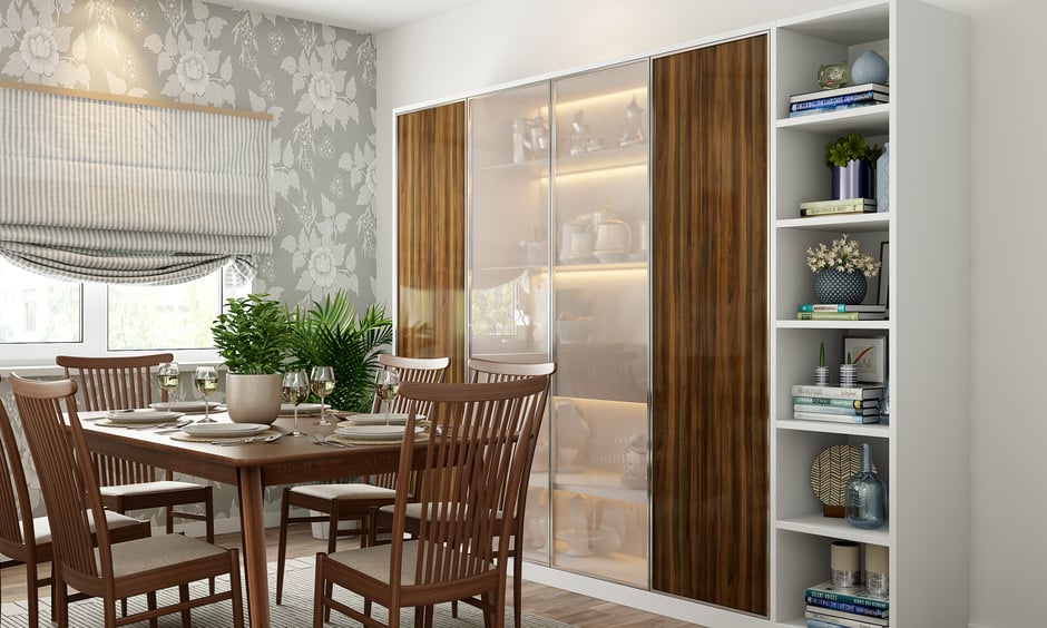 Full glass crockery unit with wooden panels and shelf lighting enhances style and convenience.