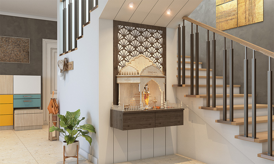 Wall-mounted pooja unit setup with elegant design and soft lighting in a living room.