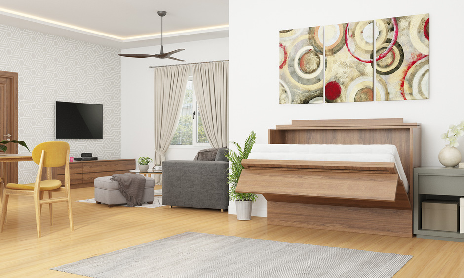 Stylish loft-style apartment with high ceilings, a mezzanine bedroom, and industrial decor.