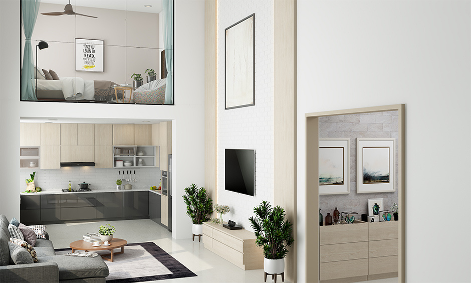Spacious modern loft apartment featuring high ceilings, large windows, and industrial decor charm.
