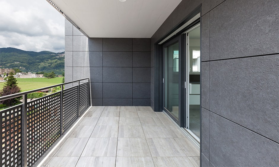 Modern stainless steel railing with intricate laser-cut patterns, adding luxury and durability to the balcony.