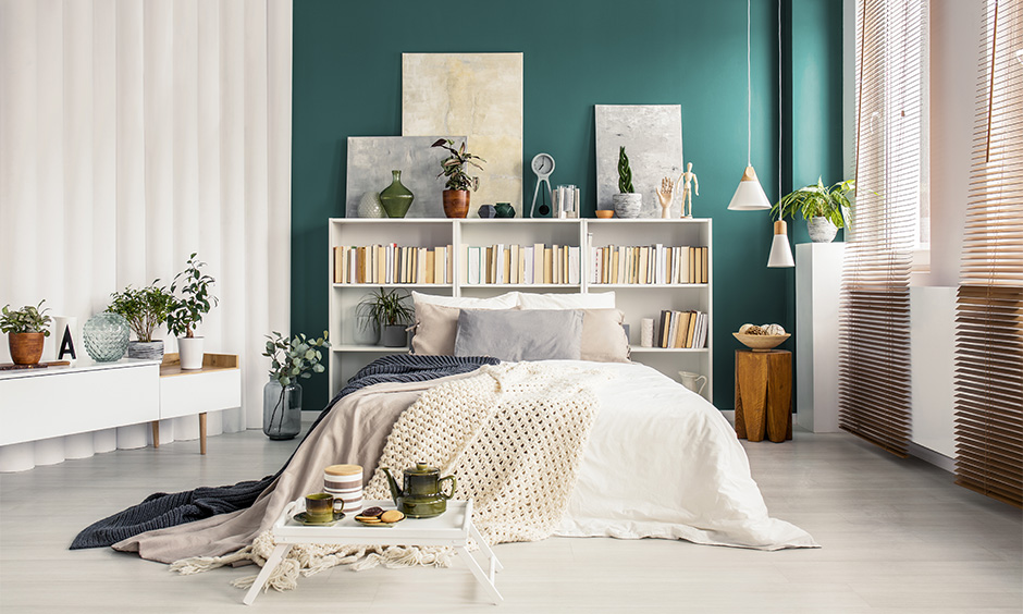 Cozy simple bed setup with layered blankets, soft lighting, and soothing bedroom decor.