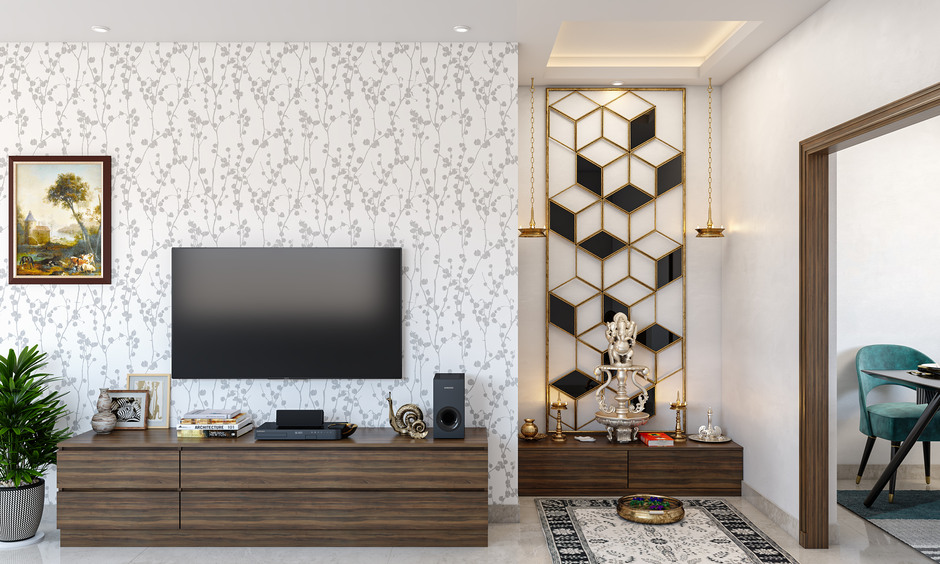 Simple pooja unit in the living room with warm LED lighting, enhancing decor and creating a serene vibe.