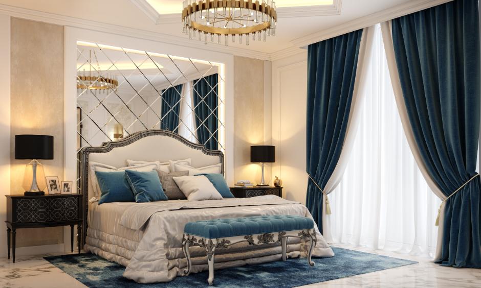 Small bedroom decorating idea for couple: mirrors enhance light and create spacious, stylish vibes.