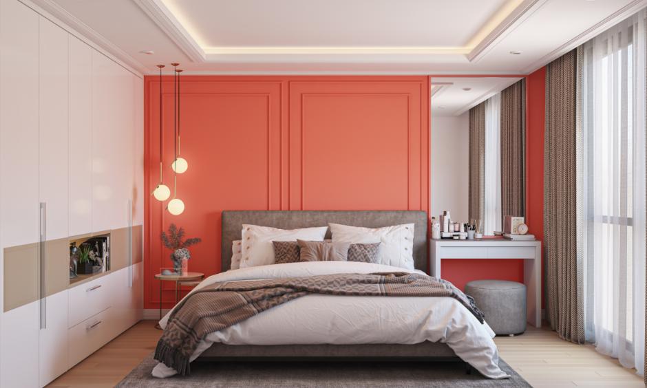 Sleek accessories and soothing colours in a cozy, small apartment bedroom