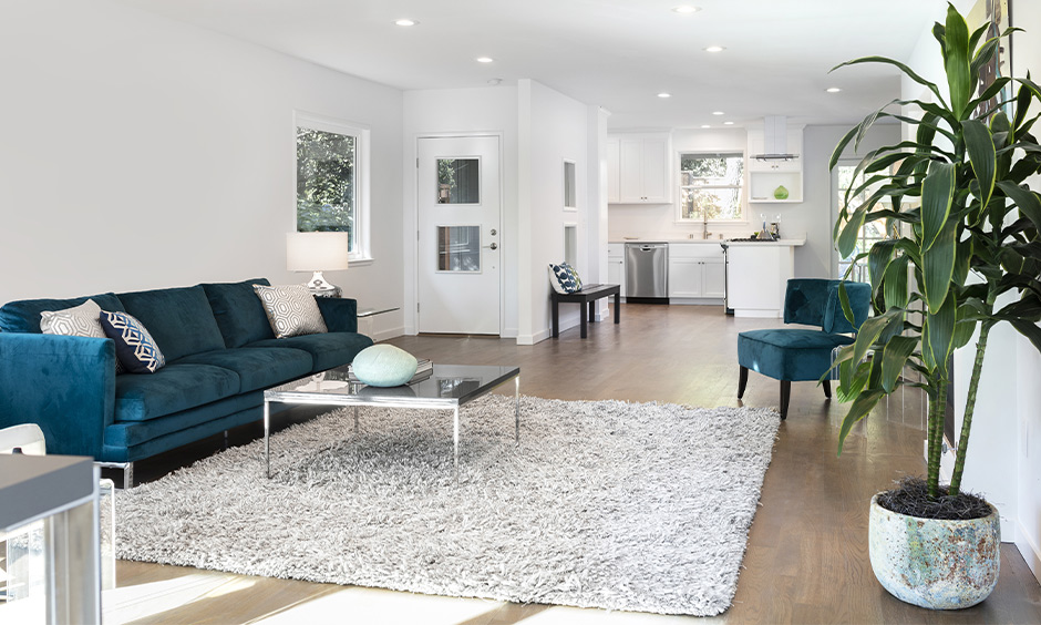 Layered rugs enhance warmth and texture in a stylish interior home renovation setup.