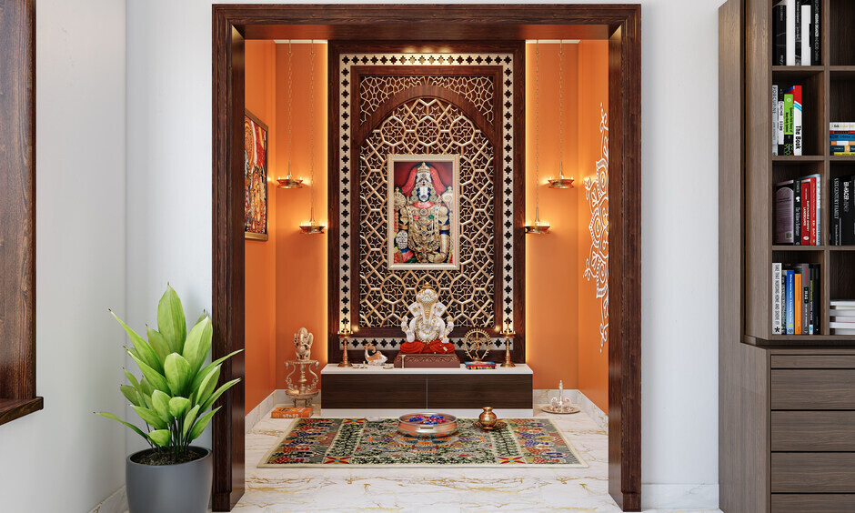 Traditional saffron pooja room with wooden door frame and calm ambience